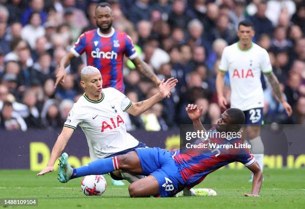 Richarlison of Tottenham Hotspur and Cheick Doucoure of Crystal Palace challenge for the ball during the Premier League match between Tottenham...