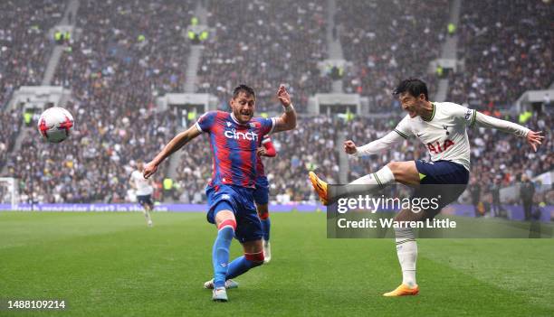 Son Heung-Min of Tottenham Hotspur crosses the ball as he is challenged by Joel Ward of Crystal Palace during the Premier League match between...