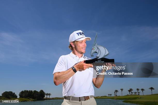 Maximilian Rottluff of Germany poses with the trophy after winning the UAE Challenge at Saadiyat Beach Golf Club on May 7, 2023 in Abu Dhabi, United...