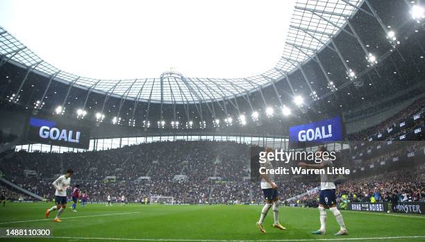 Harry Kane of Tottenham Hotspur celebrates with Richarlison of Tottenham Hotspur after scoring the opening goal during the Premier League match...