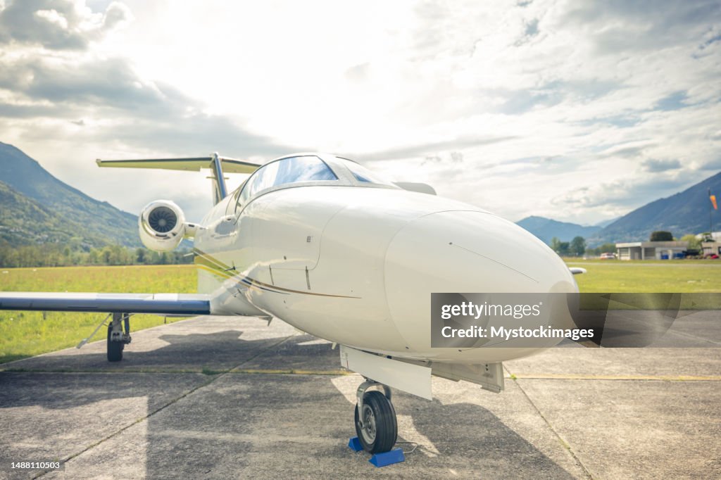 Private jet parked on runway
