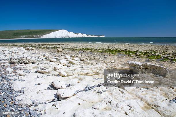 seven sisters cliffs from shore at cuckmere haven below seaford head. - cuckmere haven stock pictures, royalty-free photos & images