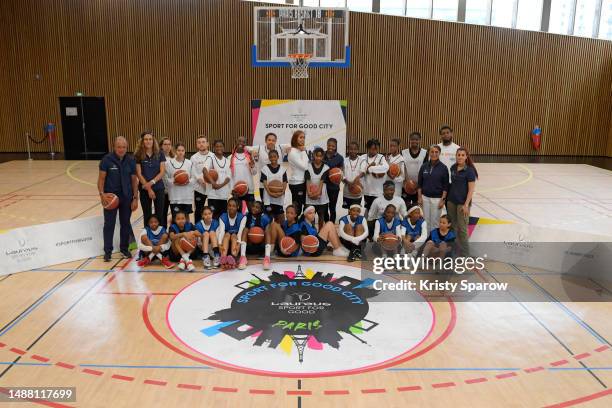 Olivia Époupa, Hugo Porta, Nawal El Moutawakel, Lisa Zimouche and Justine Dupont pose with youths ahead of the 2023 Laureus World Sport Awards Paris...