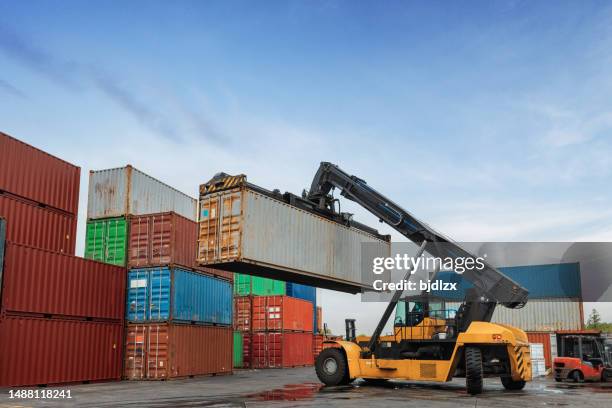 the loading truck is moving the freight container to the yard - unloading stock pictures, royalty-free photos & images