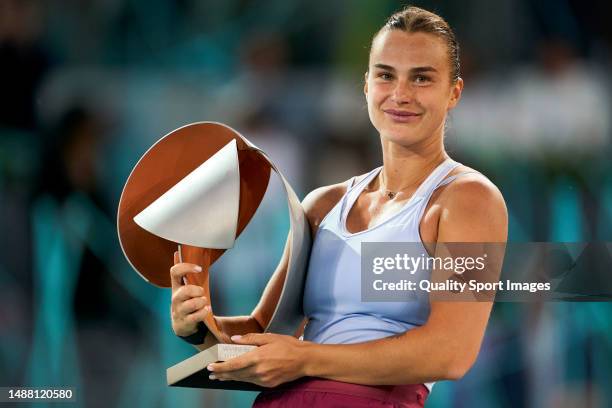 Aryna Sabalenka celebrates with the trophy after defeating Iga Swiatek of Poland during the women's final match on Day Thirteen of the Mutua Madrid...