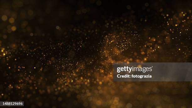 golden blurred particles. copy space - first light awards stockfoto's en -beelden