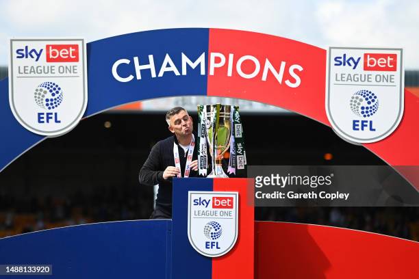 Steven Schumacher, Manager of Plymouth Argyle, kisses the Sky Bet League One trophy after victory against Port Vale in the Sky Bet League One match...
