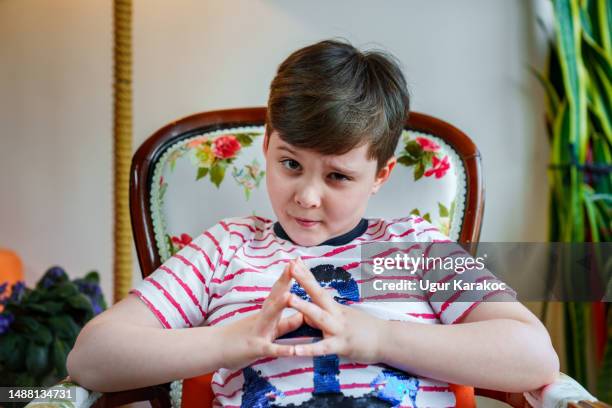 Little boy looking at the camera with a silly face