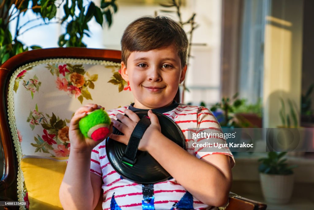 9 years old boy with a sticky ball toy