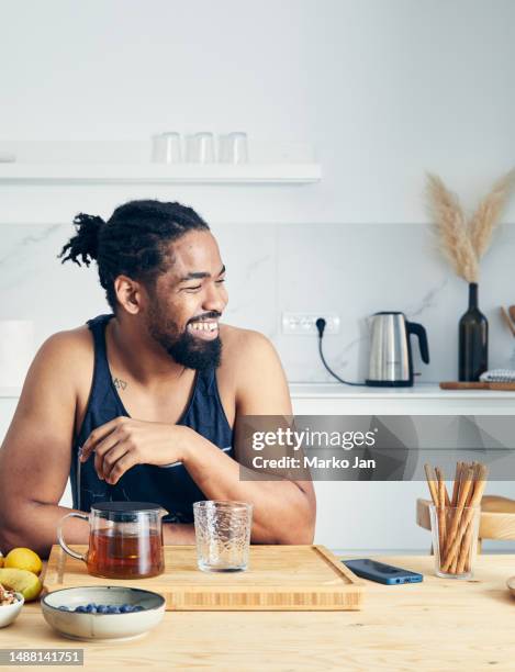 fit & healthy man making herbal tea - man workout snack stock pictures, royalty-free photos & images