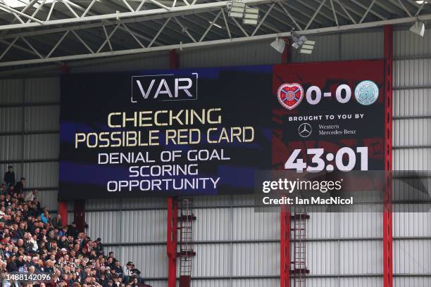 The LED board shows that VAR is checking a possible red card for "denial of goal scoring opportunity" during the Cinch Scottish Premiership match...