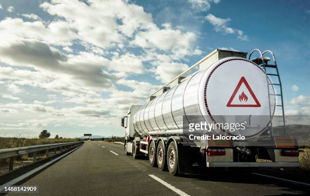 transportation of flammable material by road. - brandbaar stockfoto's en -beelden