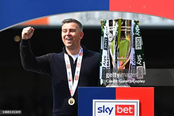 Steven Schumacher, Manager of Plymouth Argyle, celebrates with the Sky Bet League One trophy after victory against Port Vale in the Sky Bet League...