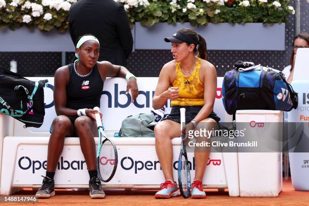 Coco Gauff and Jessica Pegula of United States look on during a break in between sets against Victoria Azarenka and Beatriz Haddad Maia of Brazil...