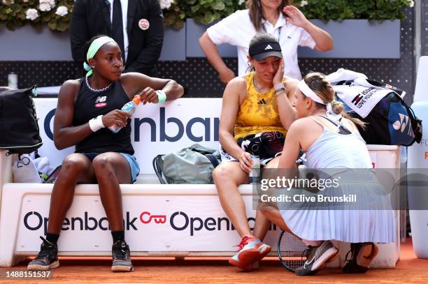 Victoria Azarenka with partner Beatriz Haddad Maia of Brazil interacts with Coco Gauff and Jessica Pegula of United States following victory in the...
