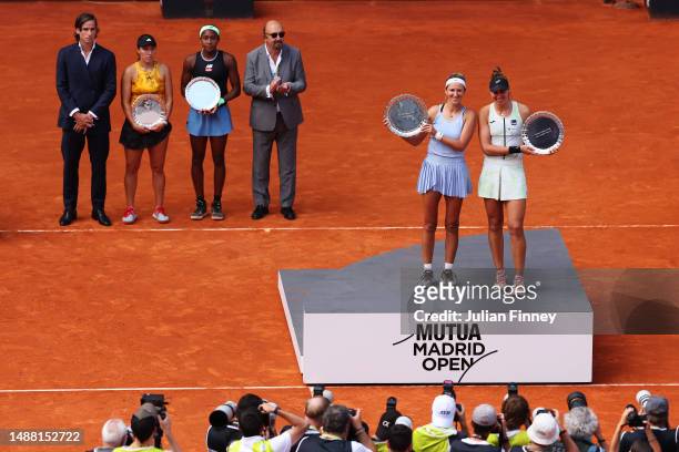 Victoria Azarenka and Beatriz Haddad Maia of Brazil pose while holding their trophy's after winning the Woman's Doubles Final match defeating Coco...