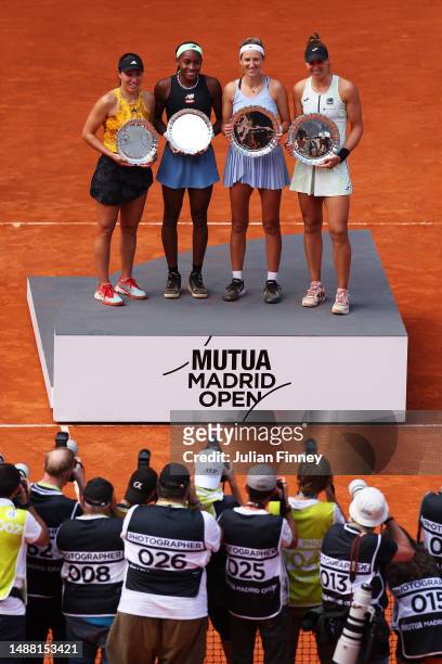 Runners up Coco Gauff and Jessica Pegula of United States and Winners Victoria Azarenka and Beatriz Haddad Maia of Brazil pose while holding their...