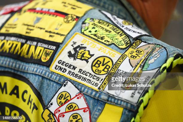 Detailed view of a Borussia Dortmund fans jacket with an anti-racist patch prior to the Bundesliga match between Borussia Dortmund and VfL Wolfsburg...