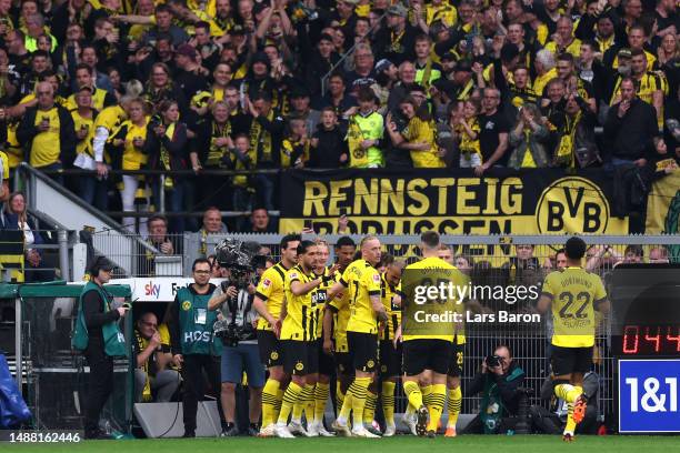 Karim Adeyemi of Borussia Dortmund celebrates with teammates after scoring the team's first goal during the Bundesliga match between Borussia...