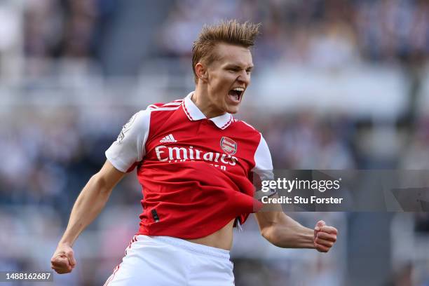 Martin Odegaard of Arsenal celebrates after scoring the team's first goal during the Premier League match between Newcastle United and Arsenal FC at...