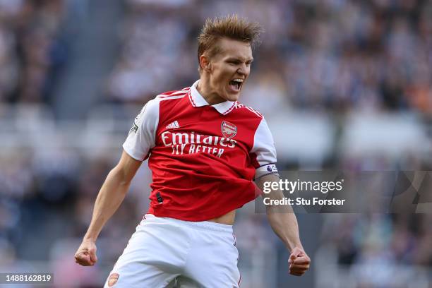 Martin Odegaard of Arsenal celebrates after scoring the team's first goal during the Premier League match between Newcastle United and Arsenal FC at...