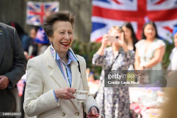 Princess Anne speaks with residents of a street as they hold a Coronation street party on May 07, 2023 in Swindon, England. The weekend of Coronation...