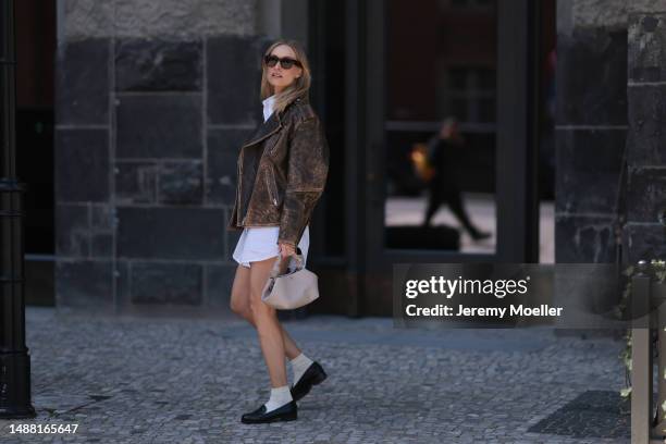 Marlies Pia Pfeifhofer seen wearing Ray-Ban black Mega Wayfarer sunglasses, LeGer by Lena Gercke white long button shirt / short dress, H&M Studio...