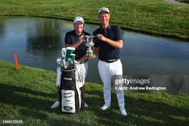 Adrian Meronk of Poland celebrates with his caddie Stuart Beck and the trophy following Day Four of the DS Automobiles Italian Open at Marco Simone...