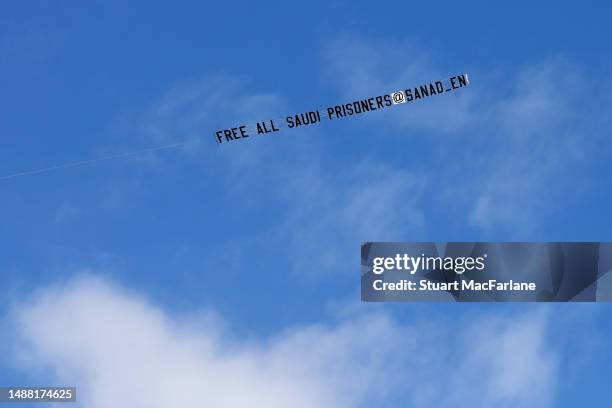 Plane flies over St. James Park towing a banner which reads "Free All Saudi Prisoners @Sanad_en" during the Premier League match between Newcastle...