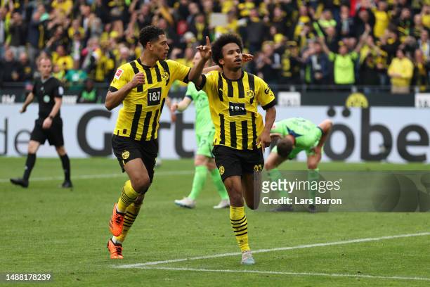 Karim Adeyemi of Borussia Dortmund celebrates alongside teammate Jude Bellingham after scoring the team's fifth goal during the Bundesliga match...
