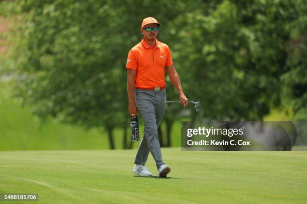Rickie Fowler of the United States walks the third hole during the final round of the Wells Fargo Championship at Quail Hollow Country Club on May...