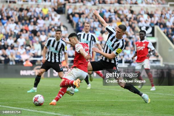 Gabriel Martinelli of Arsenal has a shot which is deflected by Fabian Schaer of Newcastle United leading to an own goal, the second goal for Arsenal,...