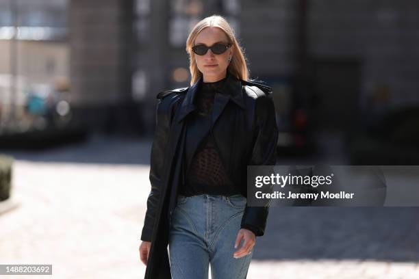Marlies Pia Pfeifhofer seen wearing Saint Laurent black sunglasses, Mugler x H&M silver stars earrings, Mugler x H&M black stars print pattern...