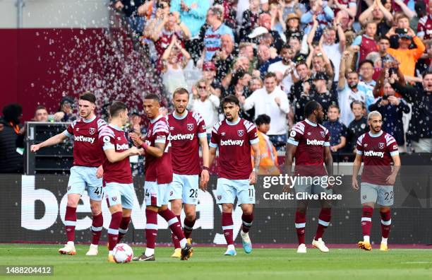 Said Benrahma of West Ham United celebrates with team mates after scoring the team's first goal during the Premier League match between West Ham...