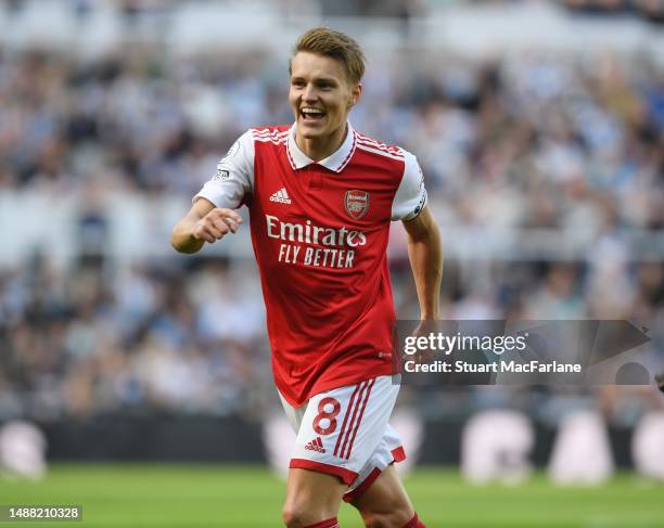 Martin Odegaard celebrates scoring the 1st Arsenal goal during the Premier League match between Newcastle United and Arsenal FC at St. James Park on...