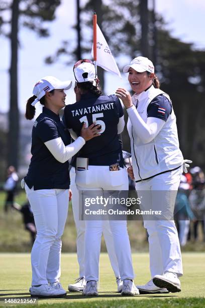 Moriya Jutanugarn, Patty Tavatanakit, Ariya Jutanugarn and Atthaya Thitikul of Team Thailand celebrate on the 18th green after advancing to the final...