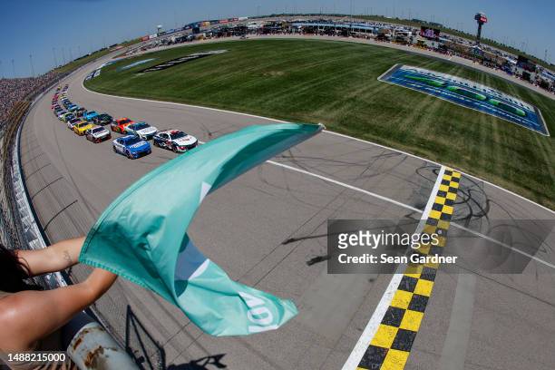 William Byron, driver of the Liberty University Chevrolet, leads to the green flag to start the NASCAR Cup Series Advent Health 400 at Kansas...