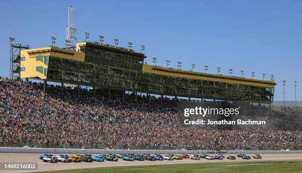 William Byron, driver of the Liberty University Chevrolet, leads to the green flag to start the NASCAR Cup Series Advent Health 400 at Kansas...