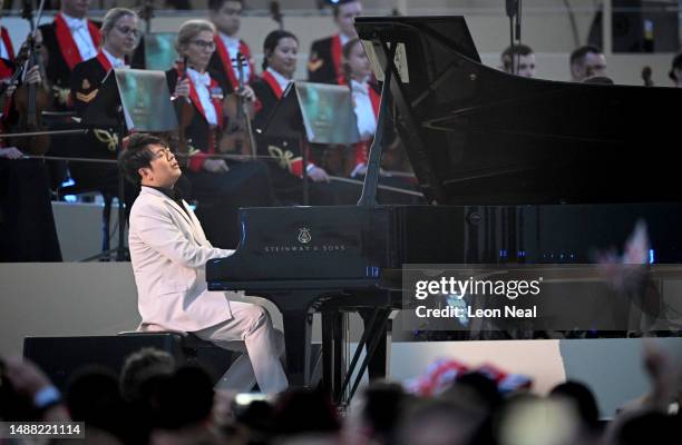 Lang Lang performs on stage during the Coronation Concert on May 07, 2023 in Windsor, England. The Windsor Castle Concert is part of the celebrations...