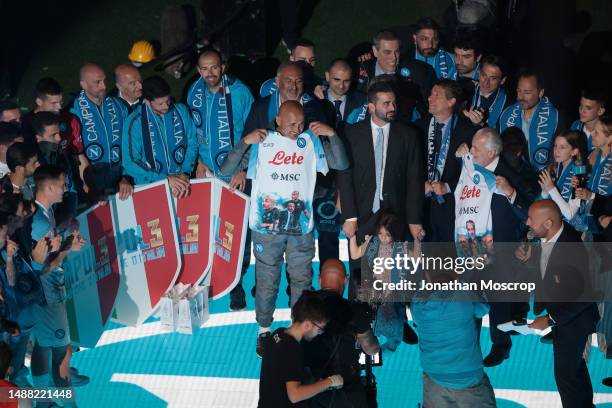 Napoli players celebrate on the stage following the final whistle of the Serie A match between SSC Napoli and ACF Fiorentina at Stadio Diego Armando...