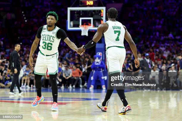 Marcus Smart and Jaylen Brown of the Boston Celtics high five against the Philadelphia 76ers d1qin game four of the Eastern Conference Second Round...