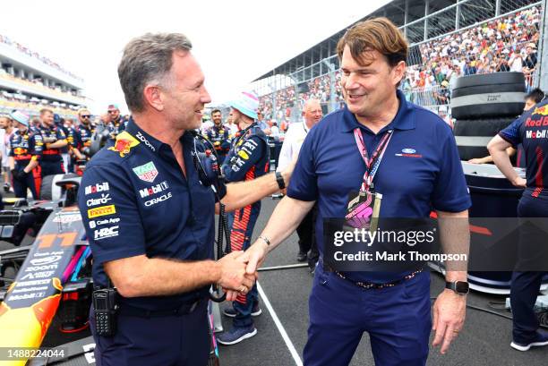 Red Bull Racing Team Principal Christian Horner shakes hands with Jim Farley, CEO of Ford on the grid during the F1 Grand Prix of Miami at Miami...