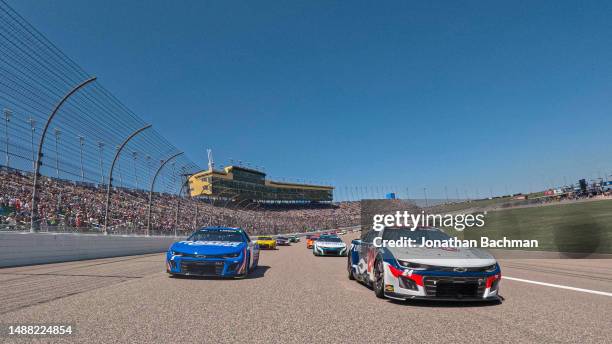 William Byron, driver of the Liberty University Chevrolet, and Kyle Larson, driver of the HendrickCars.com Chevrolet, plthe NASCAR Cup Series Advent...