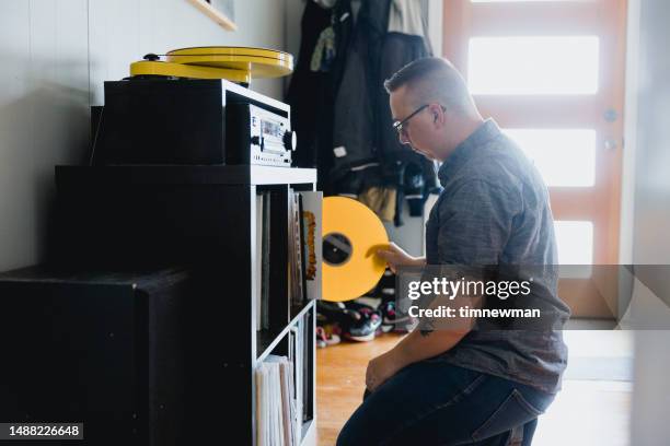 man with autism enjoying listening to records - personal stereo stockfoto's en -beelden