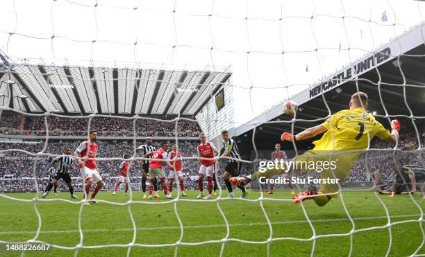 Newcastle player Fabian Schar has a header saved by Arsenal goalkeeper Aaron Ramsdale during the Premier League match between Newcastle United and...