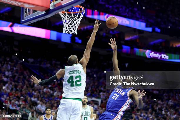 Joel Embiid of the Philadelphia 76ers shoots the ball against Al Horford of the Boston Celtics during the third quarter in game four of the Eastern...