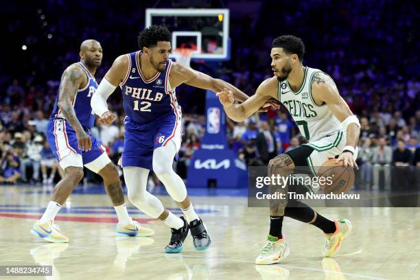 Jaylen Brown of the Boston Celtics drives to the basket against Tobias Harris of the Philadelphia 76ers during the second quarter in game four of the...