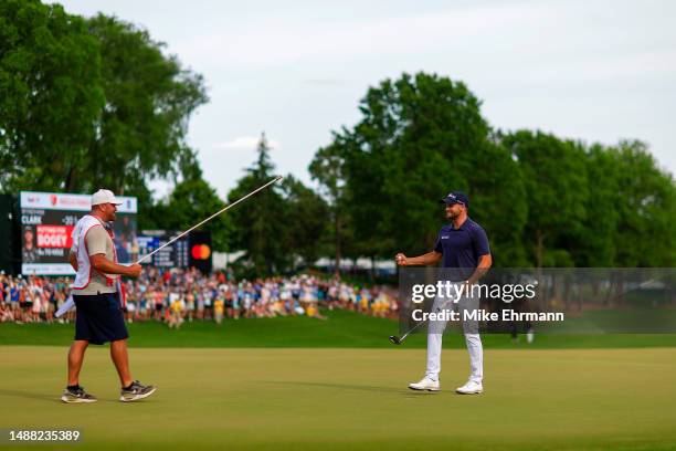 Wyndham Clark of the United States celebrates making his putt to win on the 18th green during the final round of the Wells Fargo Championship at...