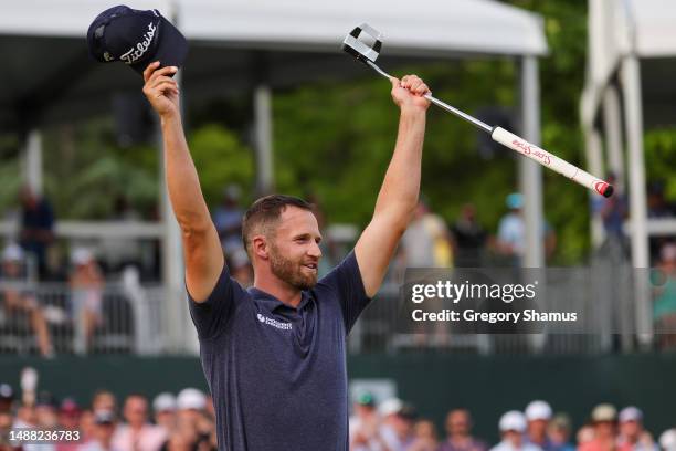 Wyndham Clark of the United States celebrates winning on the 18th green during the final round of the Wells Fargo Championship at Quail Hollow...