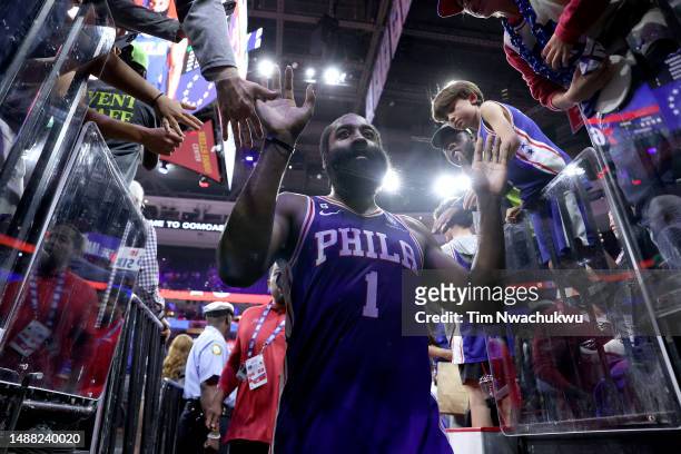 James Harden of the Philadelphia 76ers celebrates with fans after defeating the Boston Celtics in overtime of game four of the Eastern Conference...